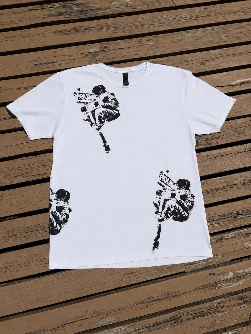 Front of white Hold On graphic t-shirt with black distressed artwork