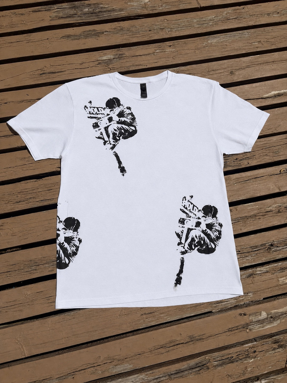 Front of white Hold On graphic t-shirt with black distressed artwork